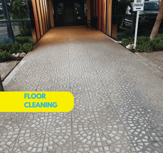 Professional floor cleaning specialist using industrial scrubber machine for deep tile and grout restoration in Sarasota commercial building